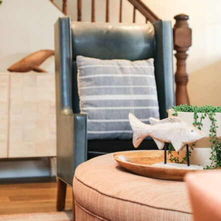 Cozy reading chair next to staircase