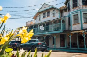 Exterior view of The Morgan Hotel with flowers in front