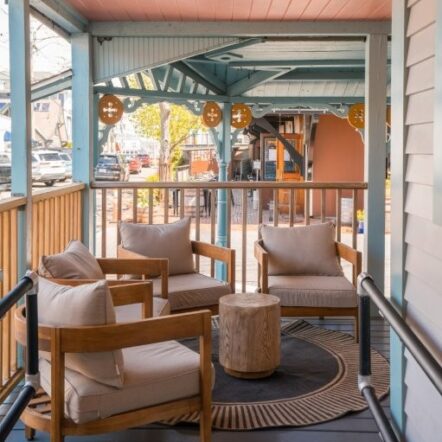 Porch seating area with pink ceiling