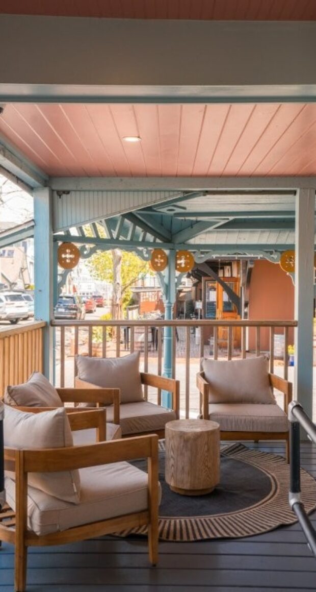 Porch seating area with pink ceiling