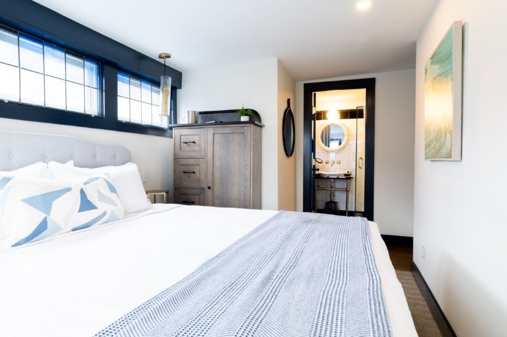 Bed with view of three large windows