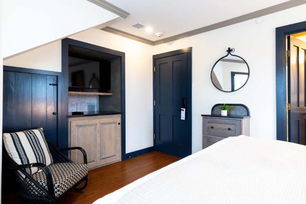 Room with armchair and open doorway