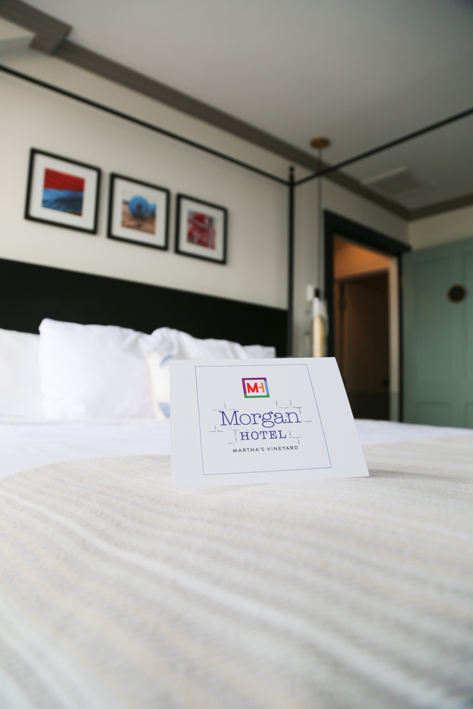 Bed with Morgan Hotel welcome sign