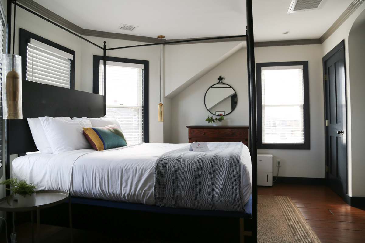 Canopy bed with corner seating area