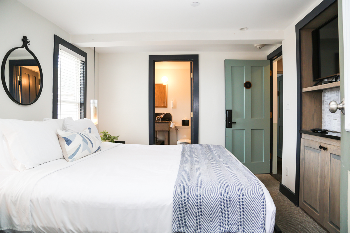 Guest room with large bed and windows