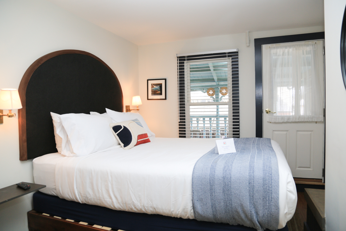 Room with arched lights and cozy bed