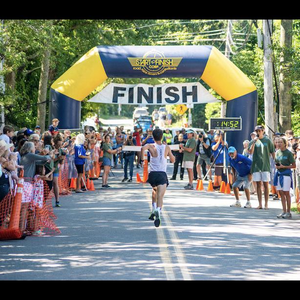Race finish line with runners