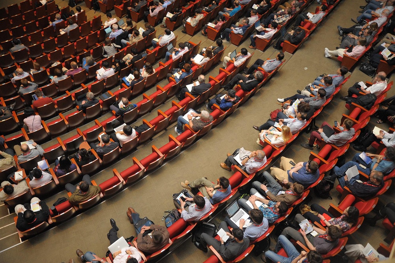 People seating in event venue