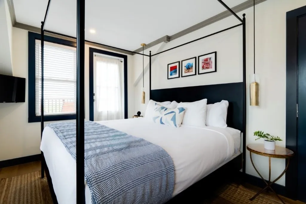 Guest room with art above bed