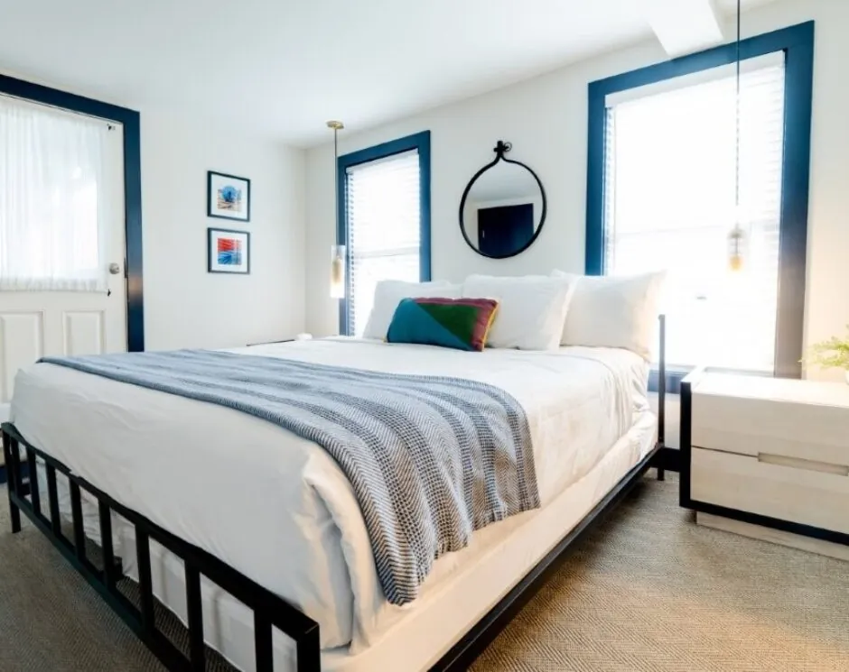 Guest room with large bed and windows