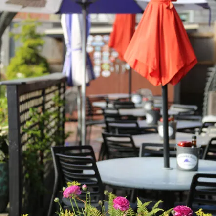 Outdoor dining with red umbrellas