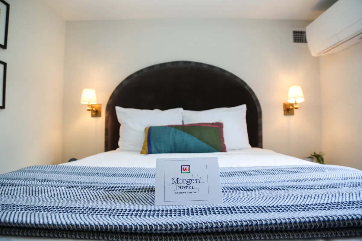 Bed with headboard and Morgan welcome sign