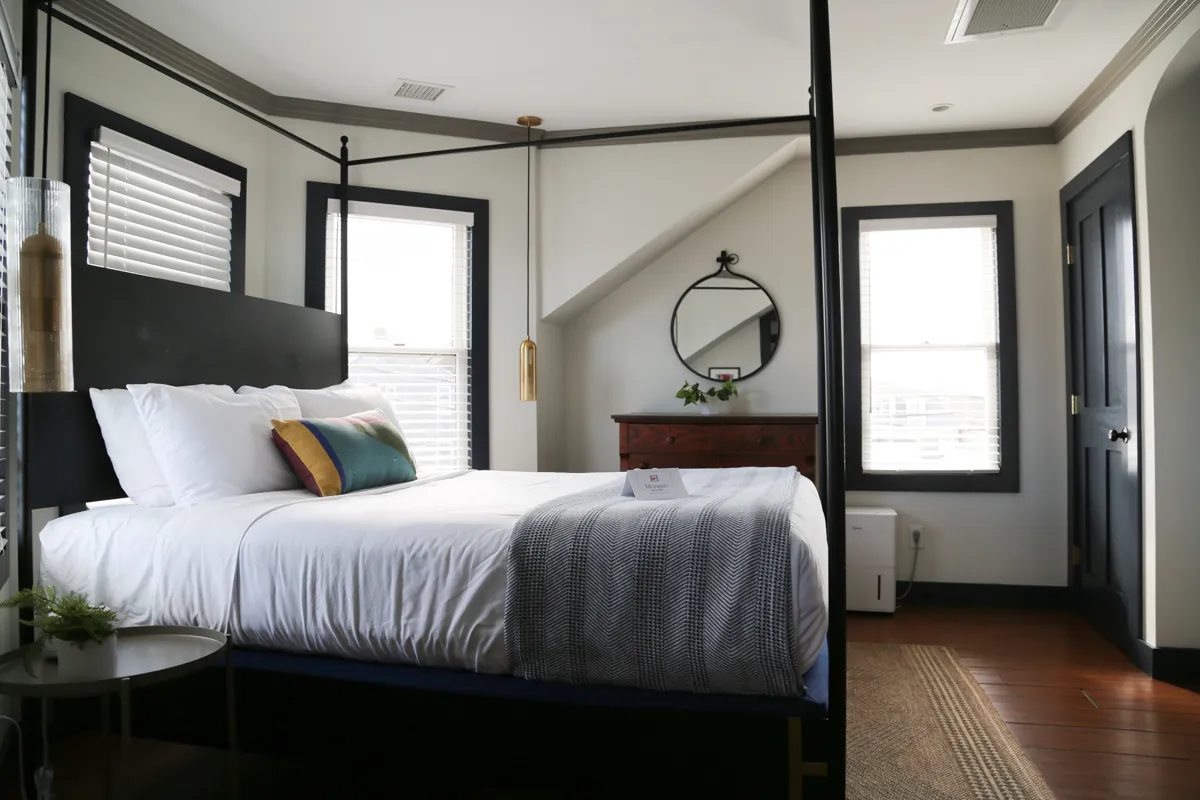 Canopy bed with corner seating area