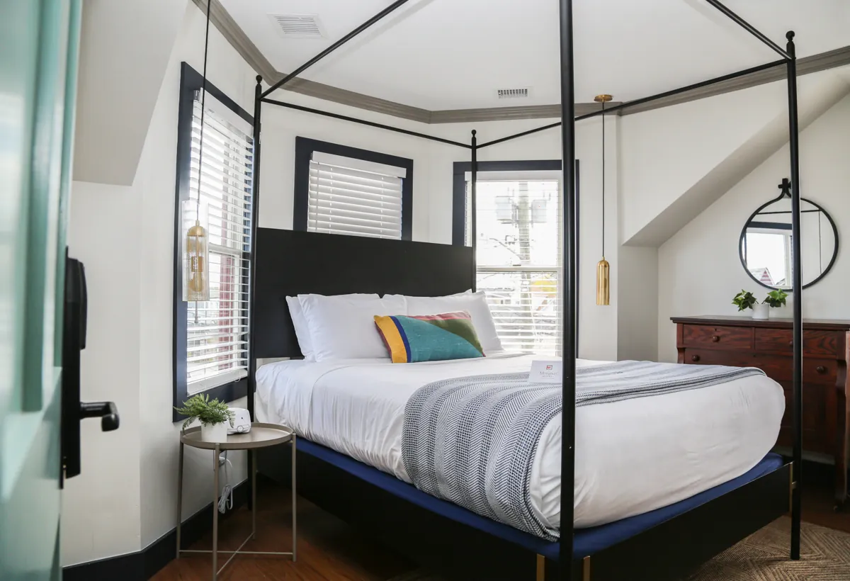 Canopy bed with corner seating area
